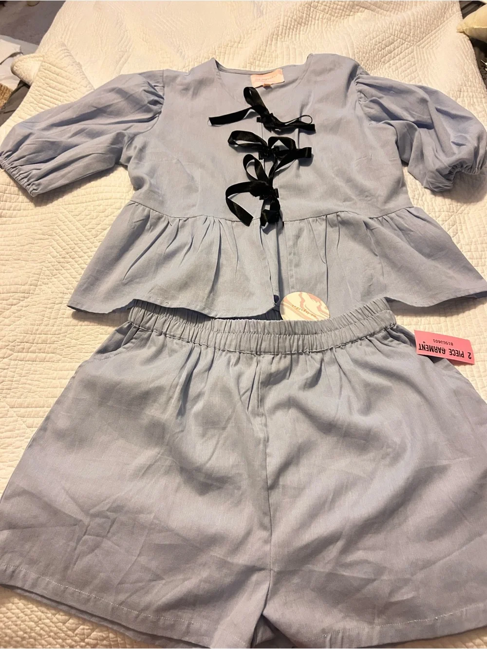Shorts and blouse light blue set .